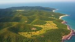 captivating HuaHin landscape, serene, rolling hills meeting the sea, photorealistic, lush greenery and rocky outcrops, highly detailed, dynamic aerial view, sharp focus, varied greens and blues, ambient light, shot with a drone camera.
