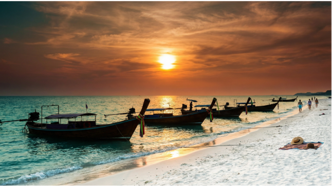 majestic HuaHin sunset, mesmerizing, silhouettes against the sun, photorealistic, reflections on water, highly detailed, vivid color gradient, long exposure, rich reds and purples, twilight glow, shot with a telephoto lens.